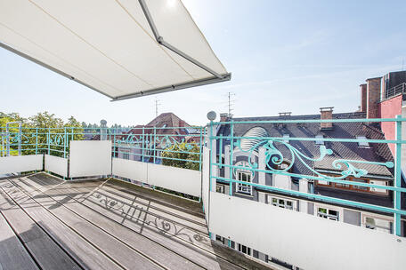 A minimalist, elegant, and light-filled 2-room apartment with a south-facing terrace in a quiet, prime location