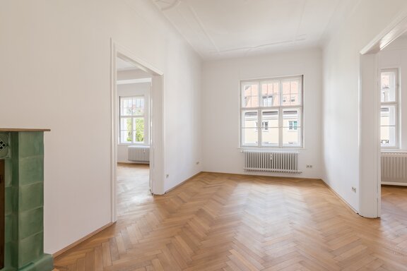 Charming dining room with a historic tiled stove