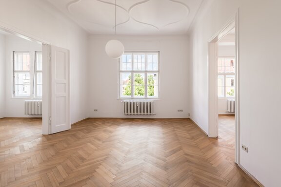 Brightly lit rooms with ornate stucco decorations