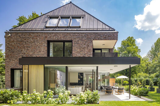 The partially covered terrace invites you to relax and enjoy the outdoors