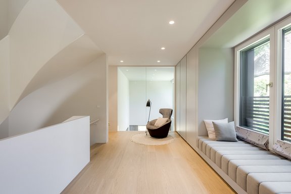 The upper floor is arranged around a gallery area