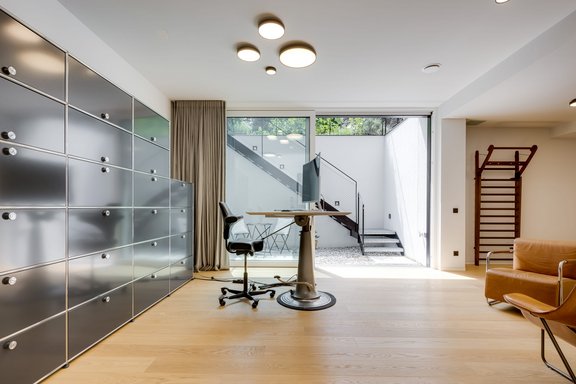 The study is adjoined by a sunny patio