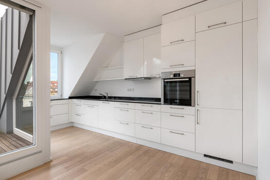L-shaped white kitchen