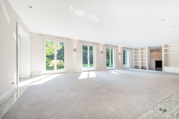 Living room with adjoining fireplace room