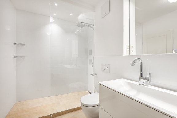 Timelessly designed bathroom with shower and tub