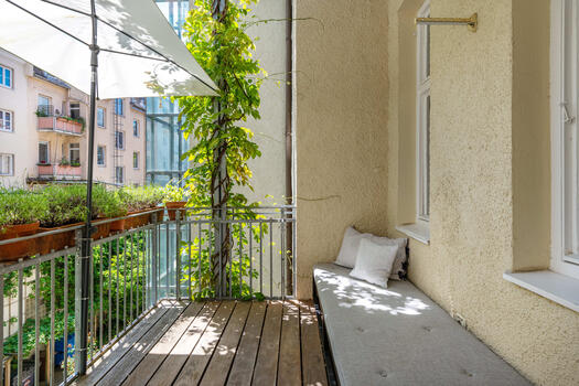 View from the balcony into the quiet, beautifully grown inner courtyard