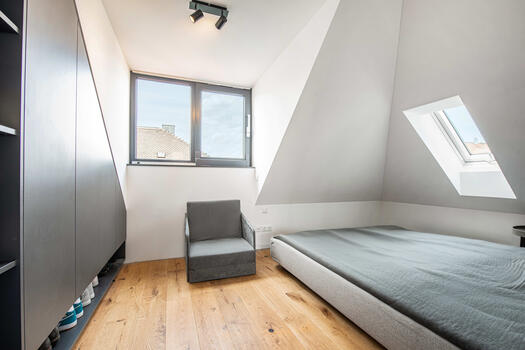 Bright bedroom with custom-made fittings