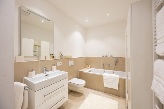Master bathroom with a bathtub and shower