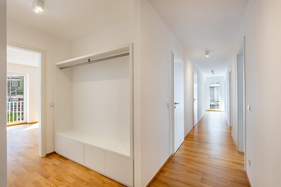 Spacious hallway with built-in wardrobes