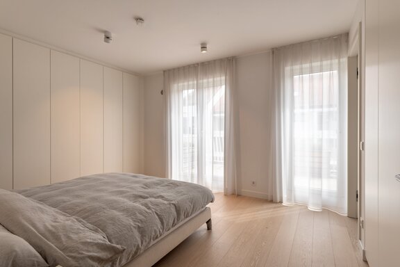 Master bedroom with high-quality custom-built cabinetry