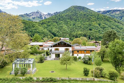 Stylish country house set against a mountain backdrop