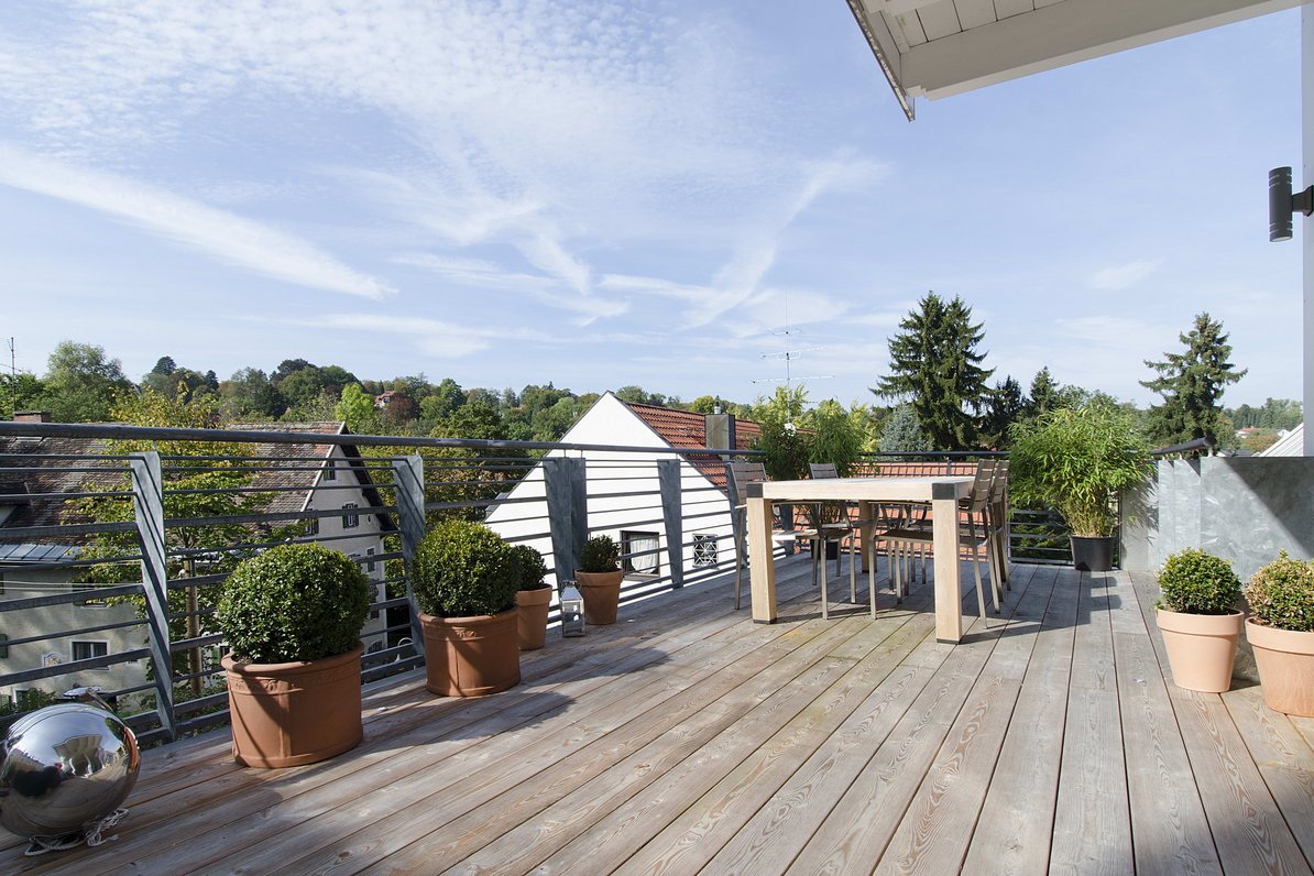 Sunny roof terrace with view over the roofs