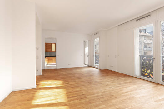 The dining area offers access to the balcony and kitchen