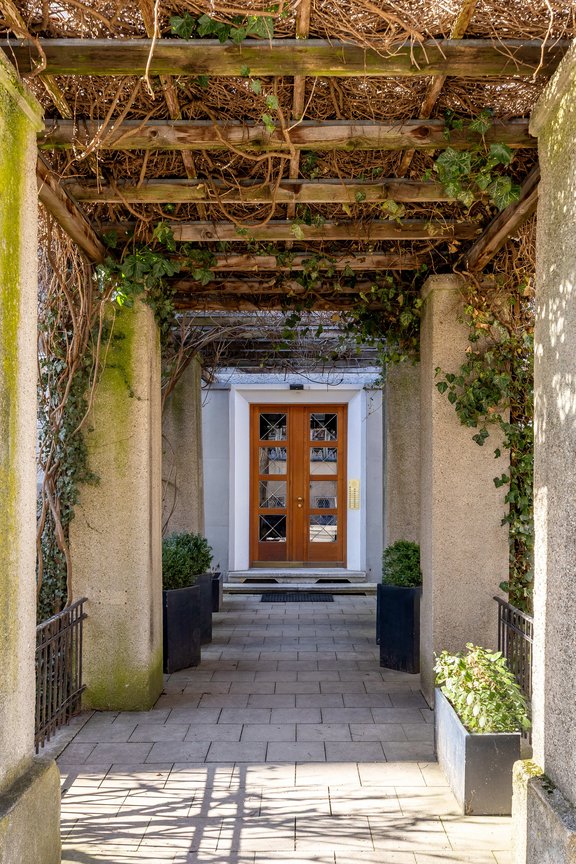 Pergola in front of the house entrance