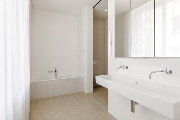 En-suite master bathroom with a mirror cabinet
