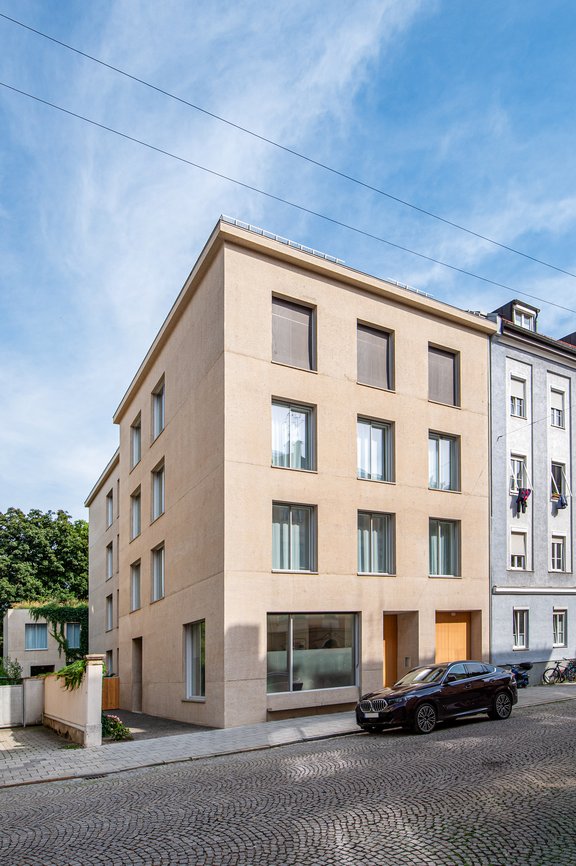 Stylish new building with a bush-hammered exposed concrete facade