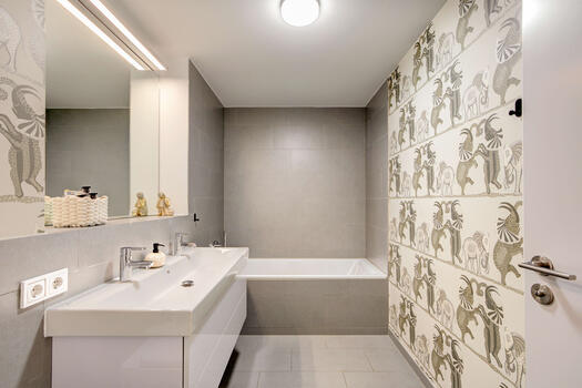 Family bathroom with bathtub