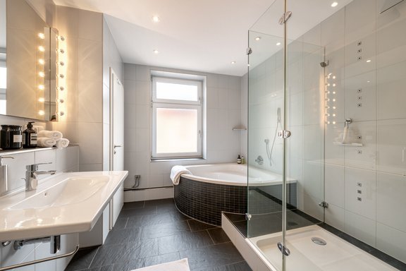 Large bathroom with a separate toilet