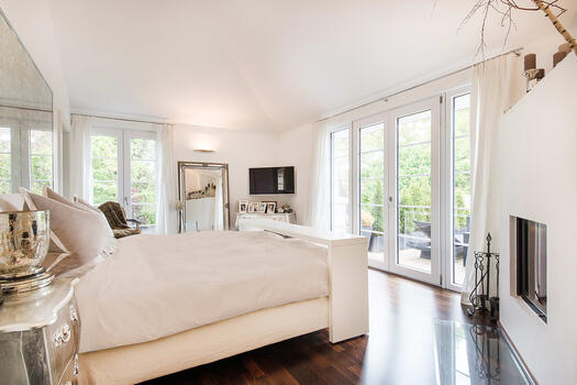 Master bedroom with open fireplace