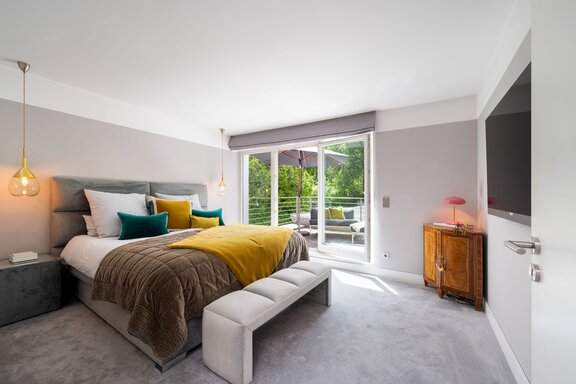 Bright master bedroom with access to the rooftop terrace