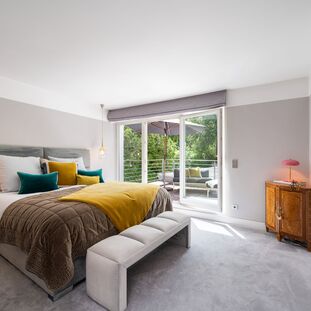 Bright master bedroom with access to the rooftop terrace