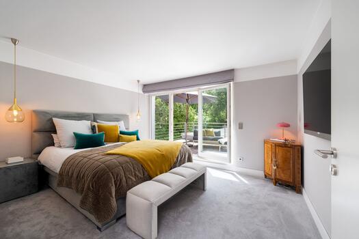 Bright master bedroom with access to the rooftop terrace