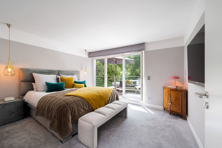Bright master bedroom with access to the rooftop terrace