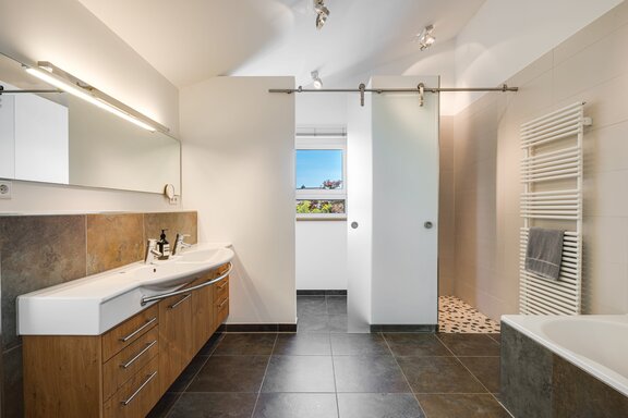 Bathroom with a separate toilet alcove