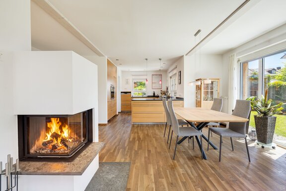 Living Room with a Fireplace & Garden View