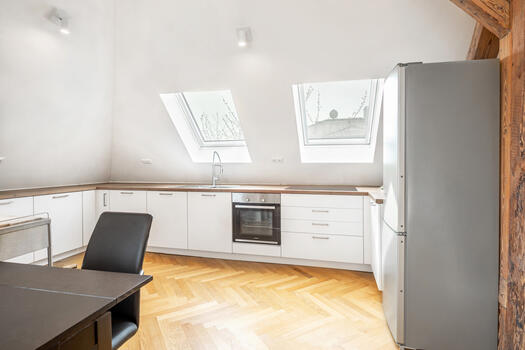 Modern fitted kitchen with white fronts